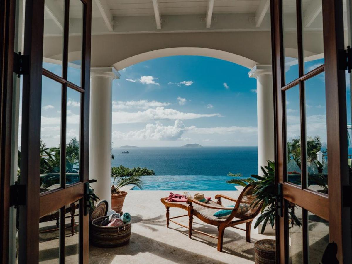 a chair sitting in front of a body of water