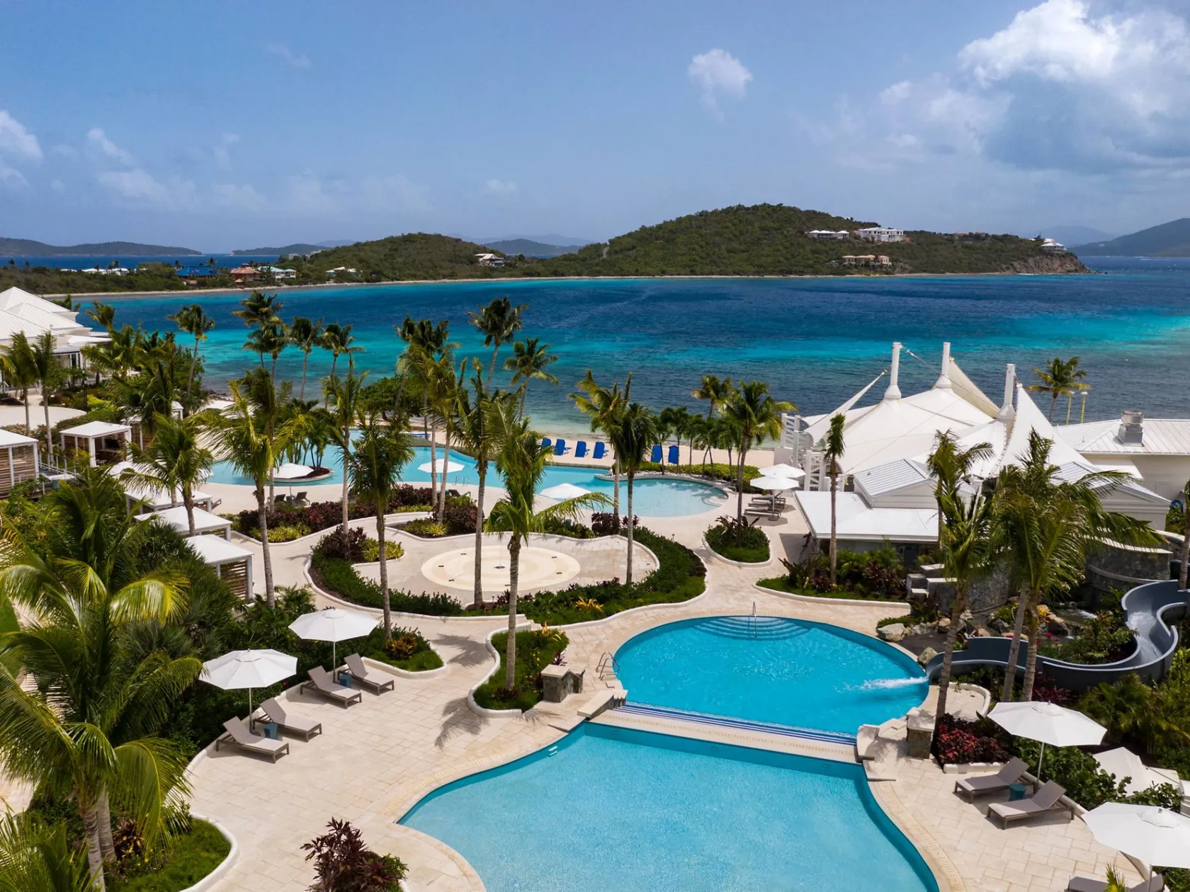 a pool next to a body of water