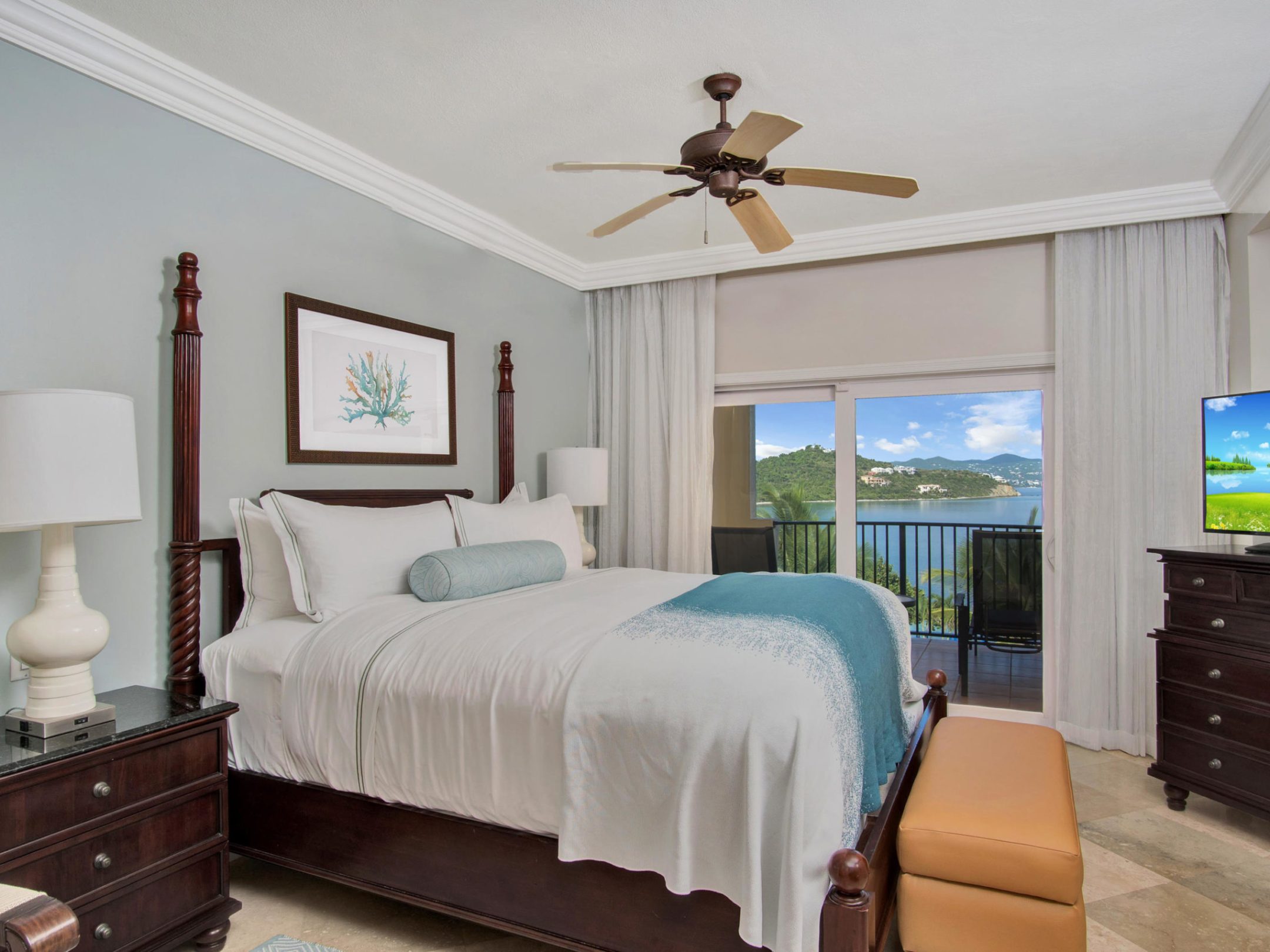 a bedroom with a bed and a flat screen tv sitting in a room