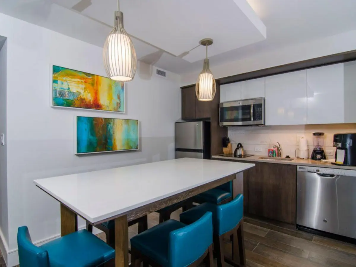 a kitchen with an island in the middle of a room