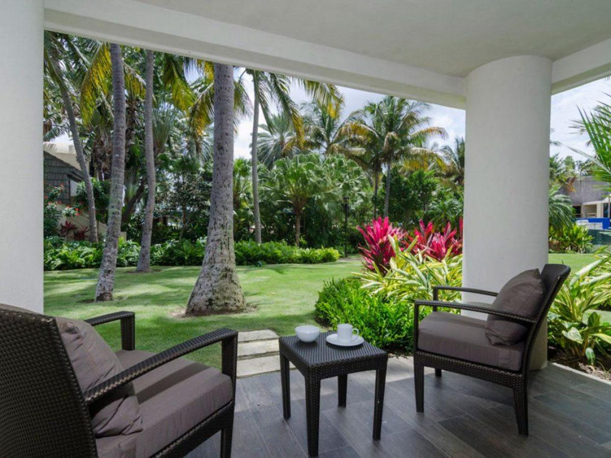 a living room filled with furniture and a large window