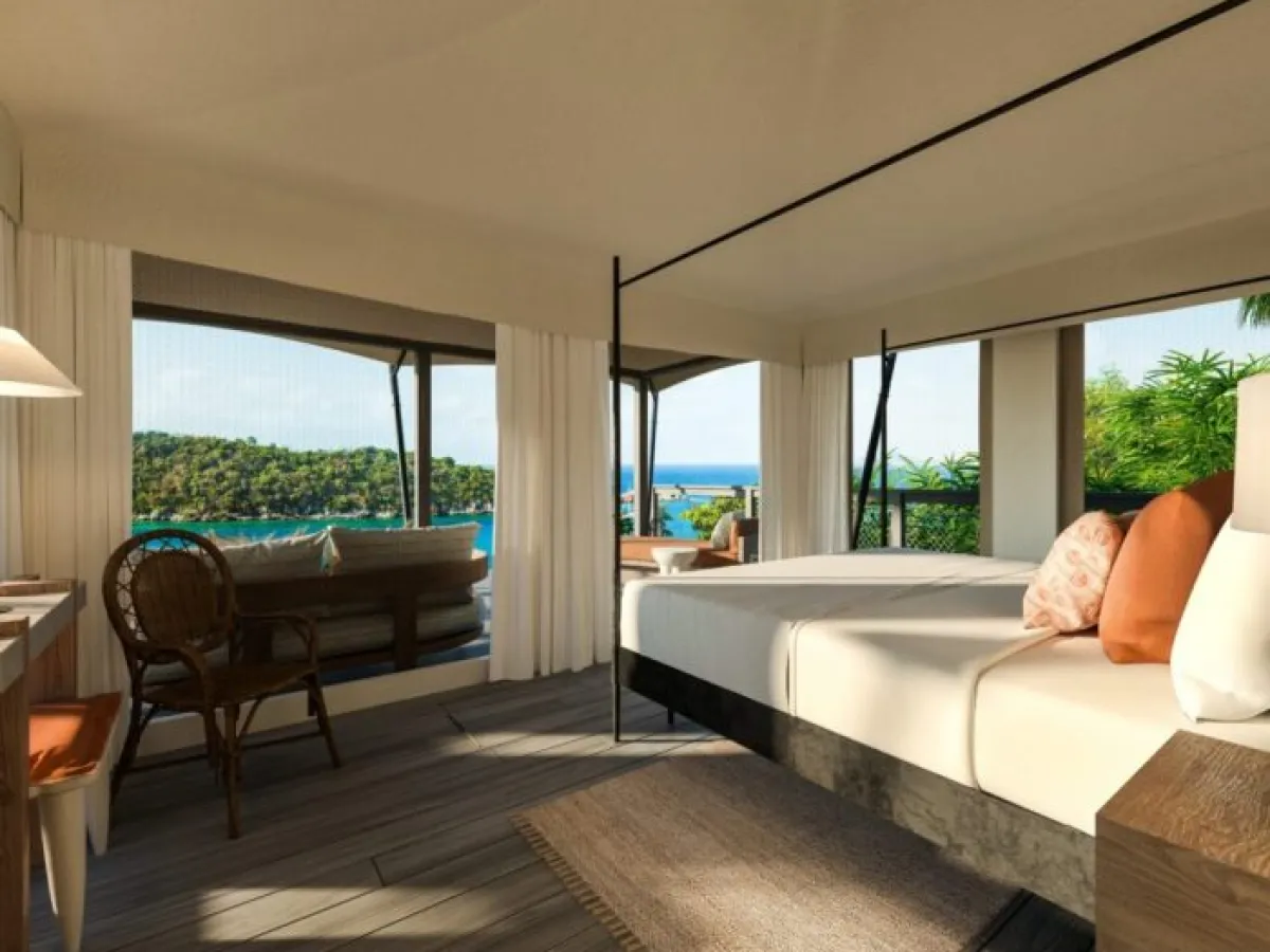 a living room filled with furniture and a large window