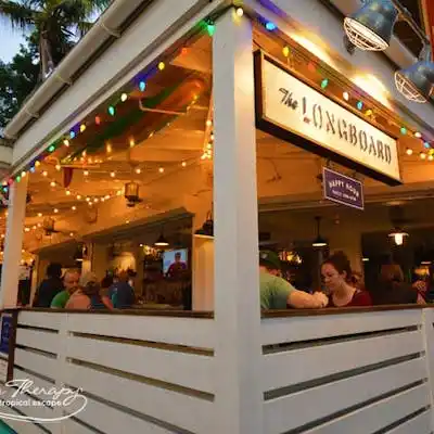 a group of people sitting in front of a store
