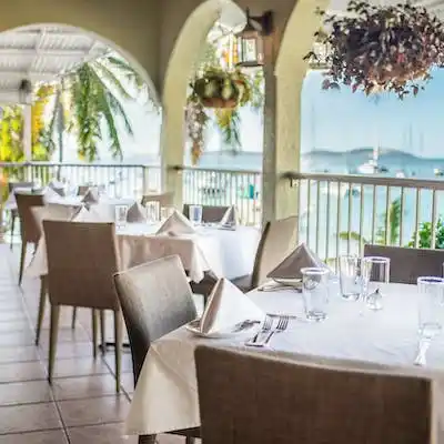 a dining room table in front of a window
