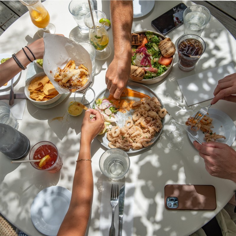 a man cutting food on a table