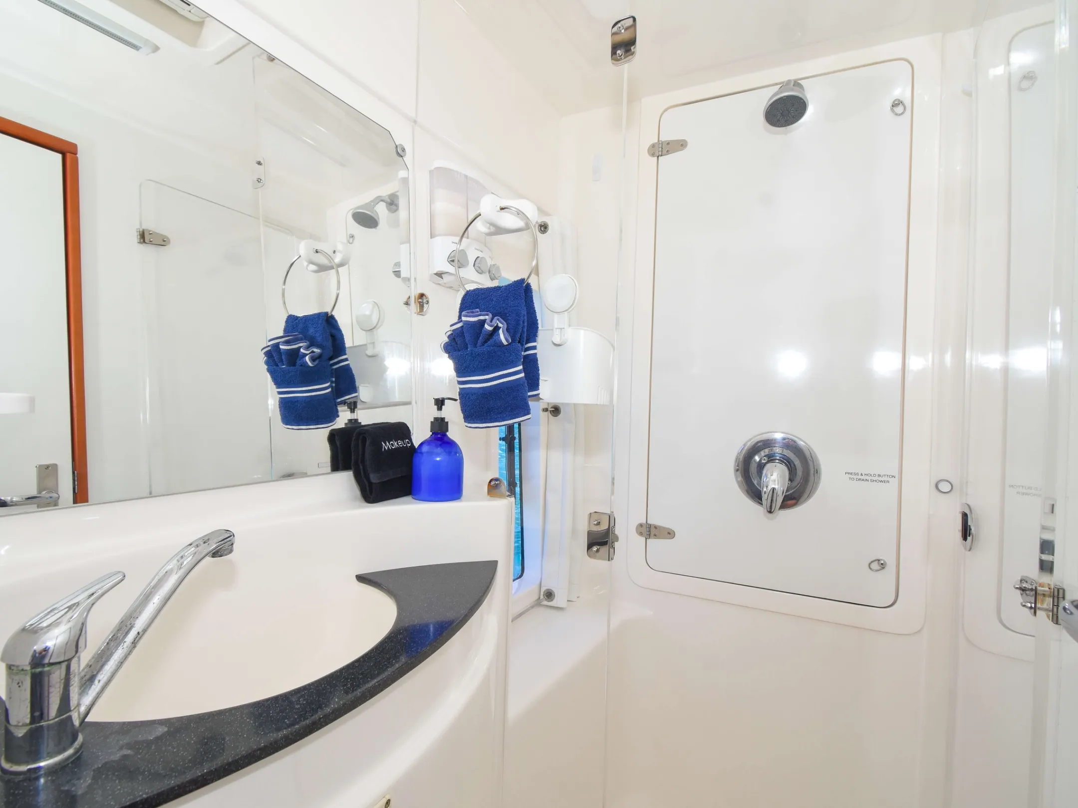 a room with a sink and a shower