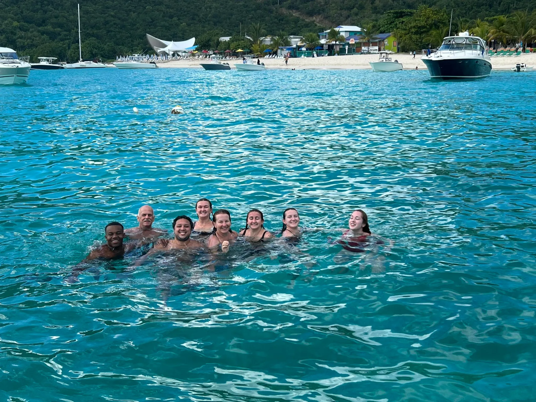 a group of people swimming in a body of water