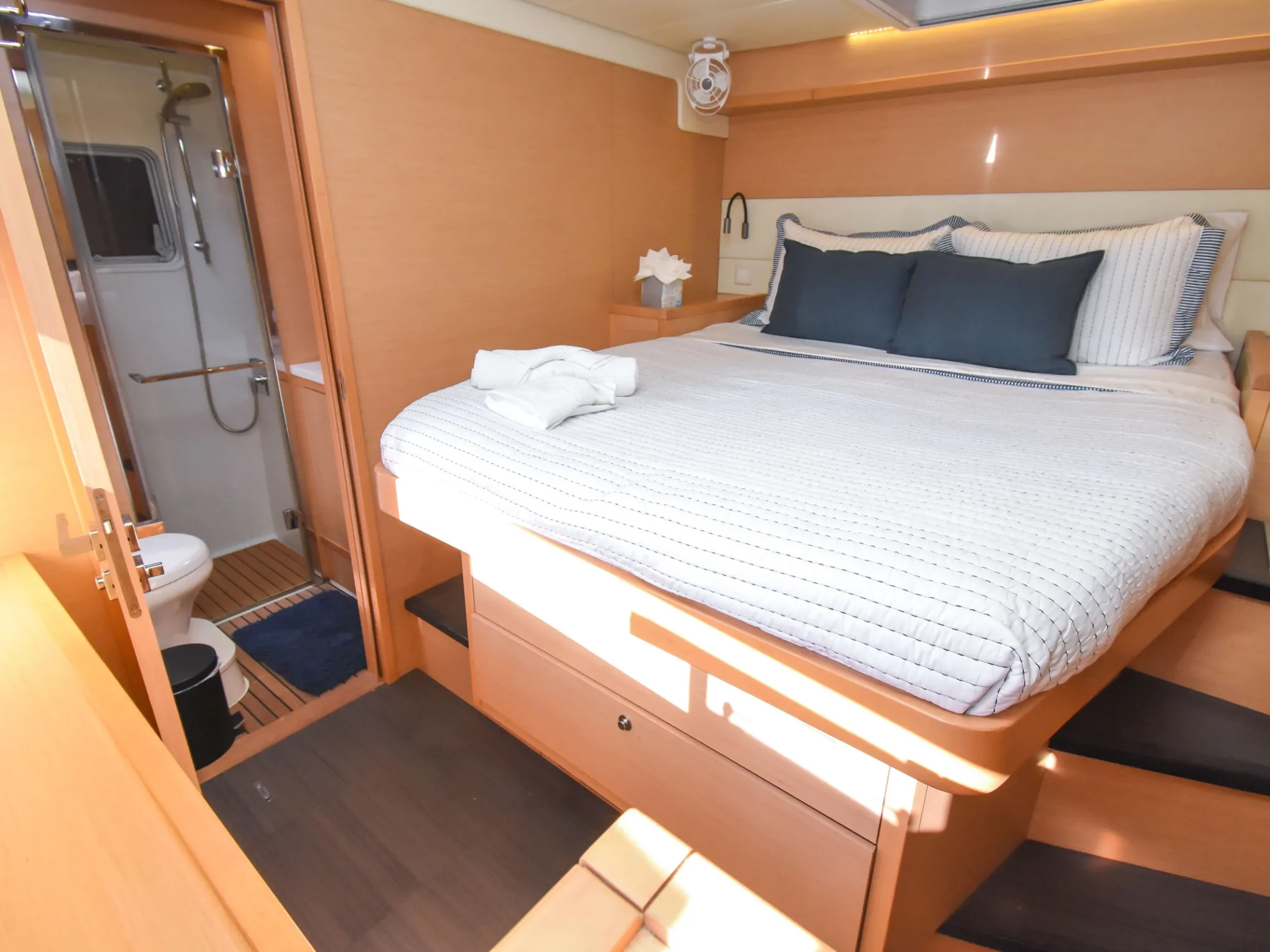 a bedroom with a bed and desk in a room