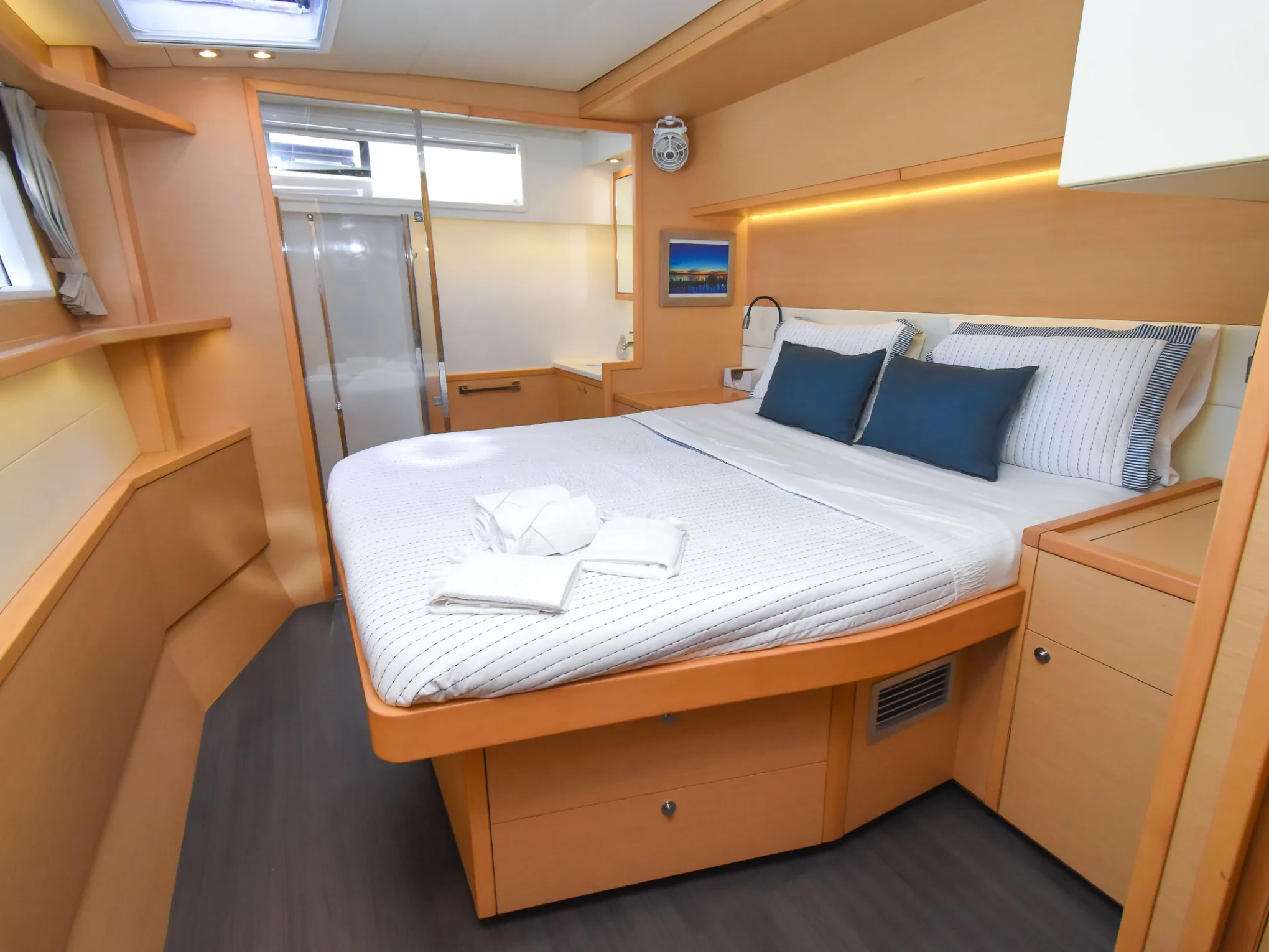 a bedroom with a bed and desk in a room