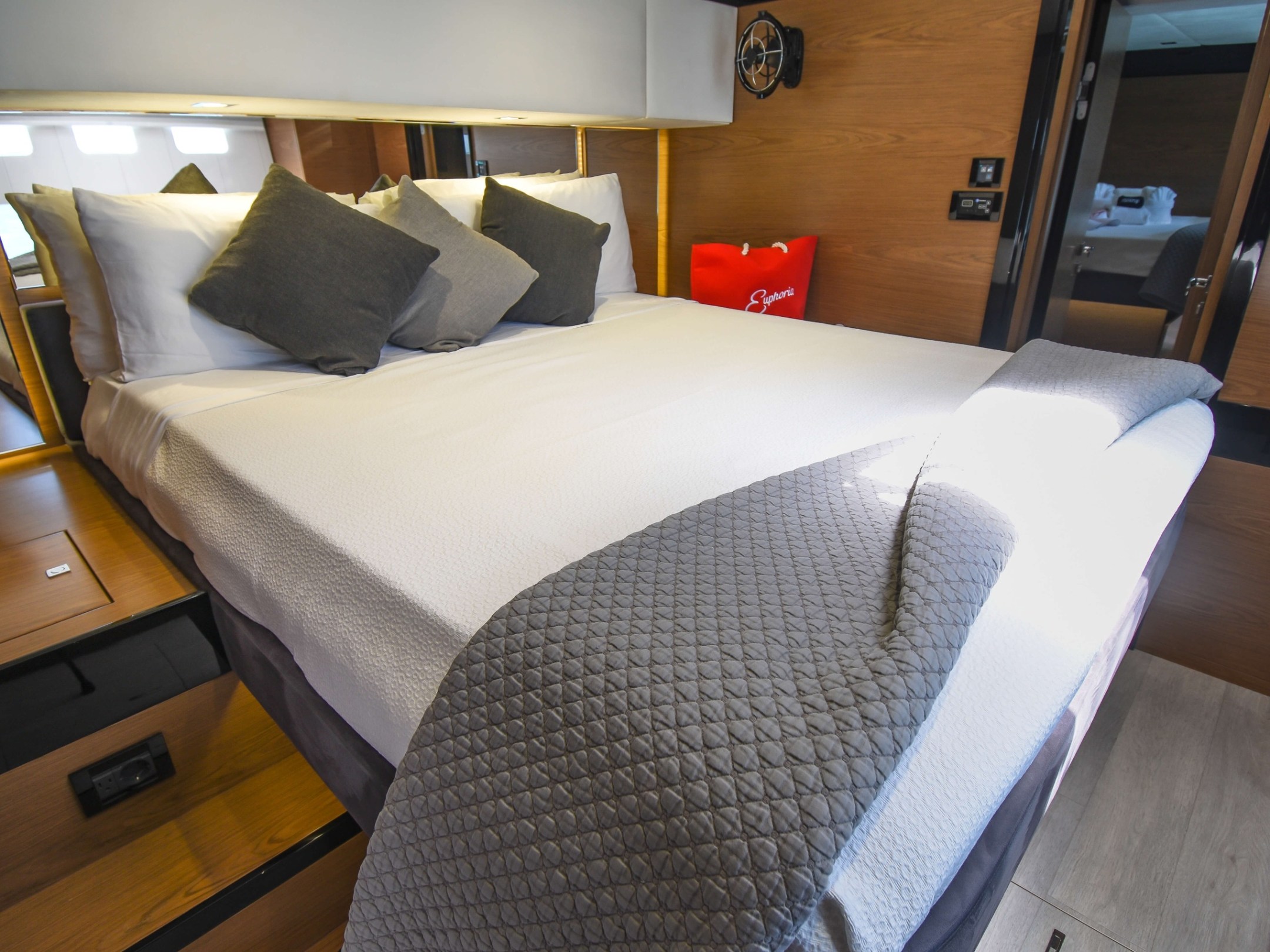 a bedroom with a bed and desk in a room