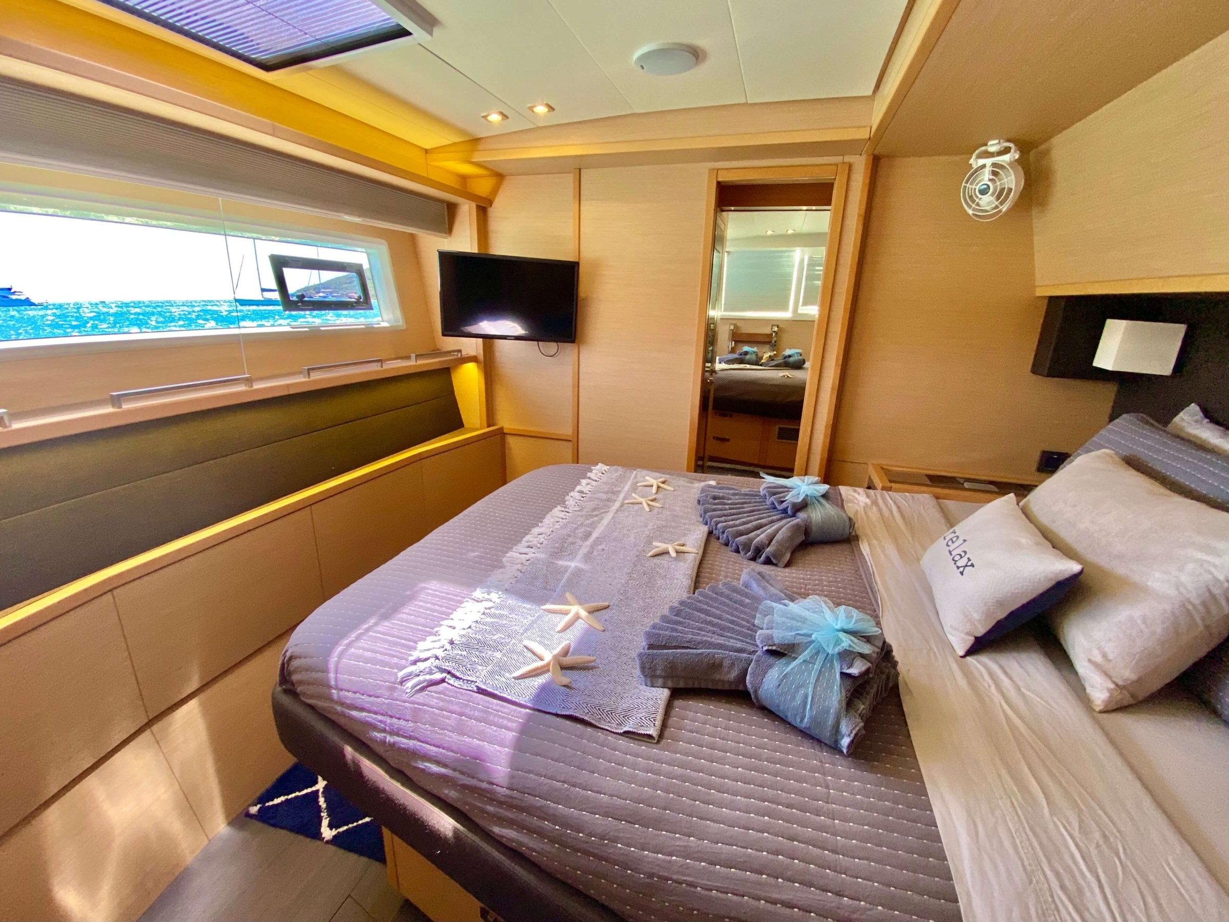 a bedroom with a bed and desk in a room