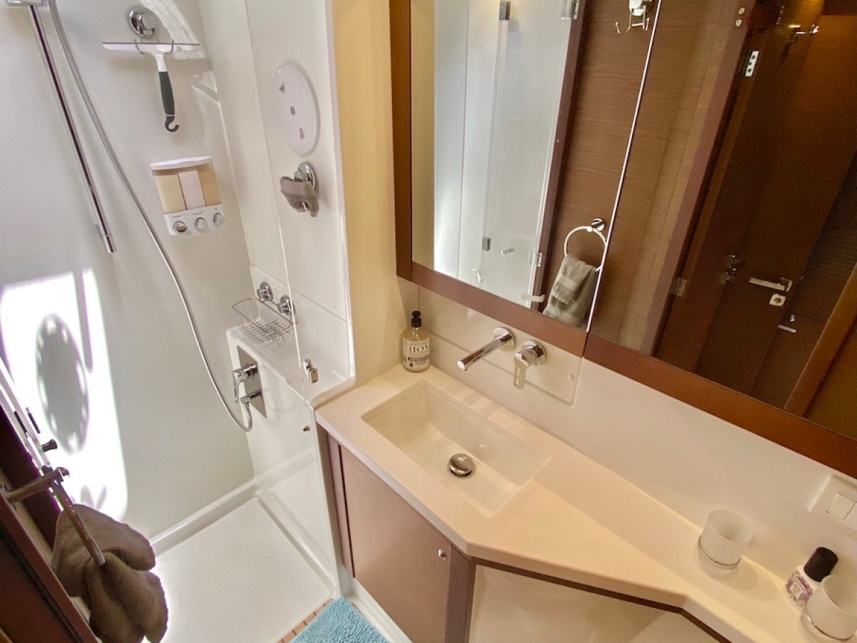 a room with a sink and a mirror