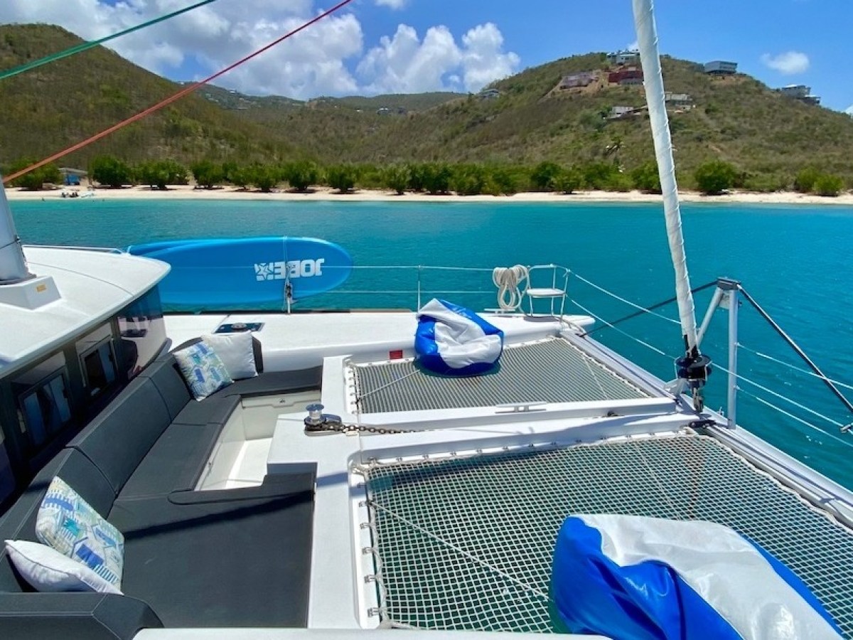 a group of people sitting at a dock