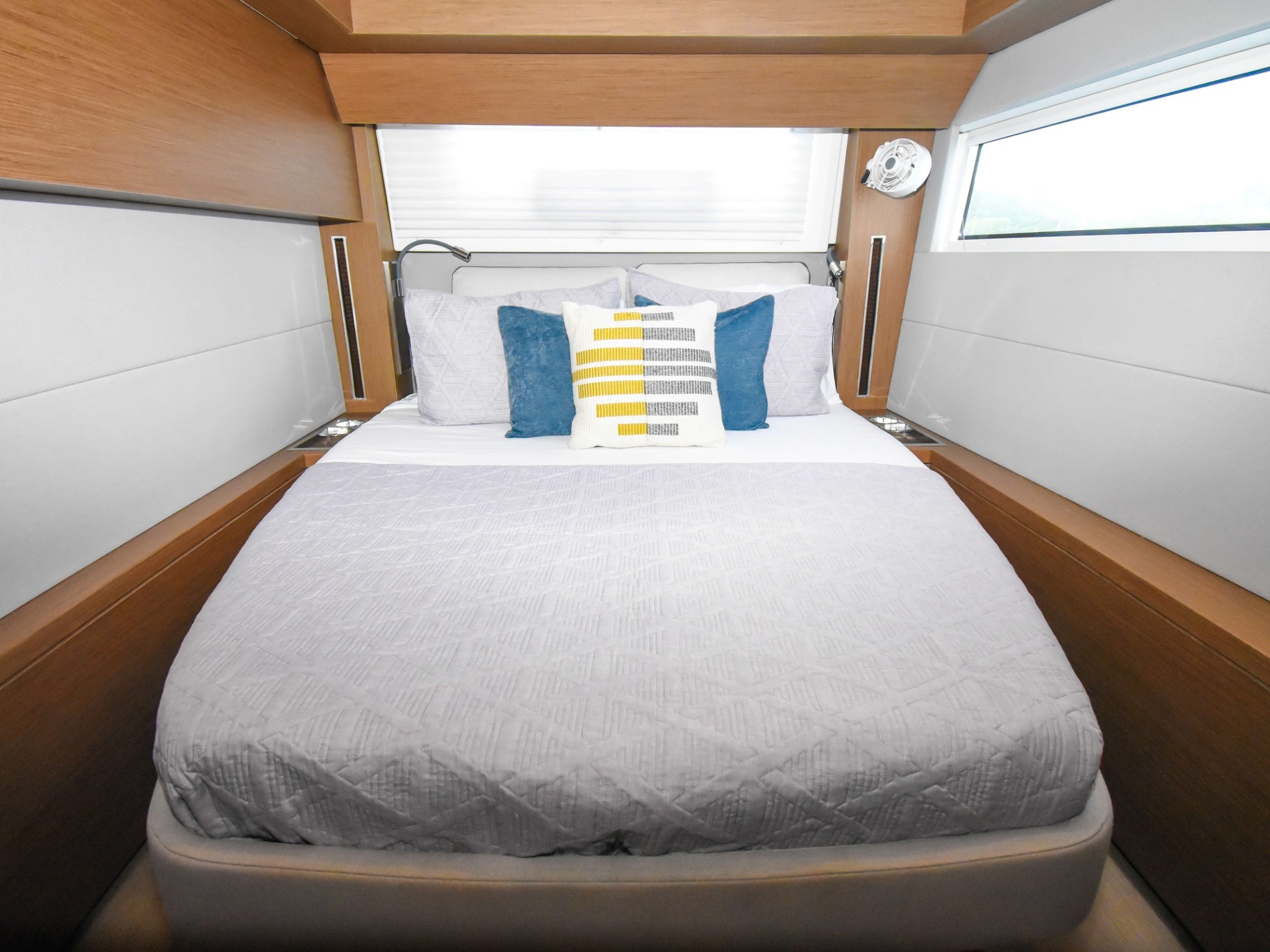 a bedroom with a bed and desk in a room