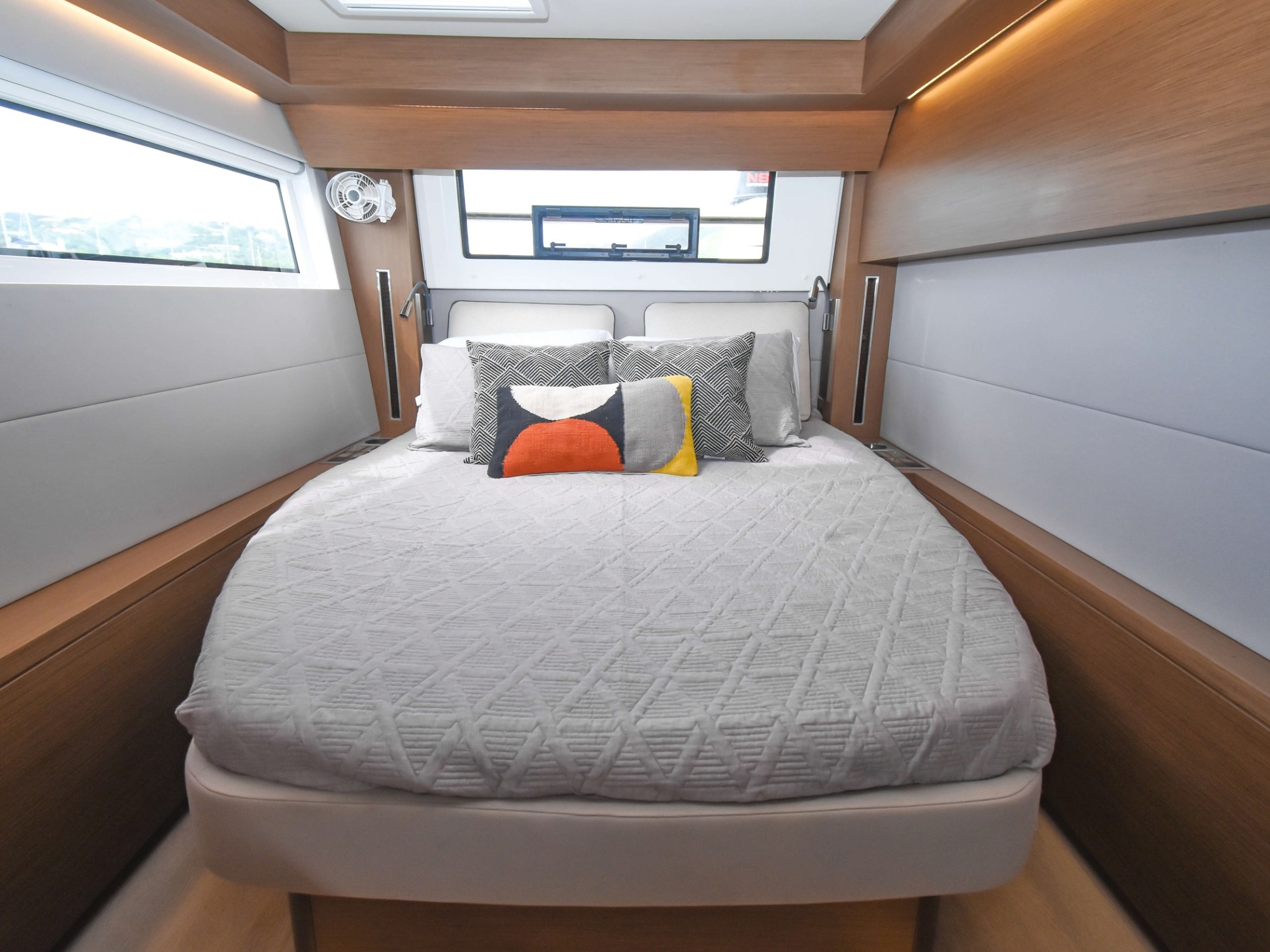 a bedroom with a bed and desk in a room