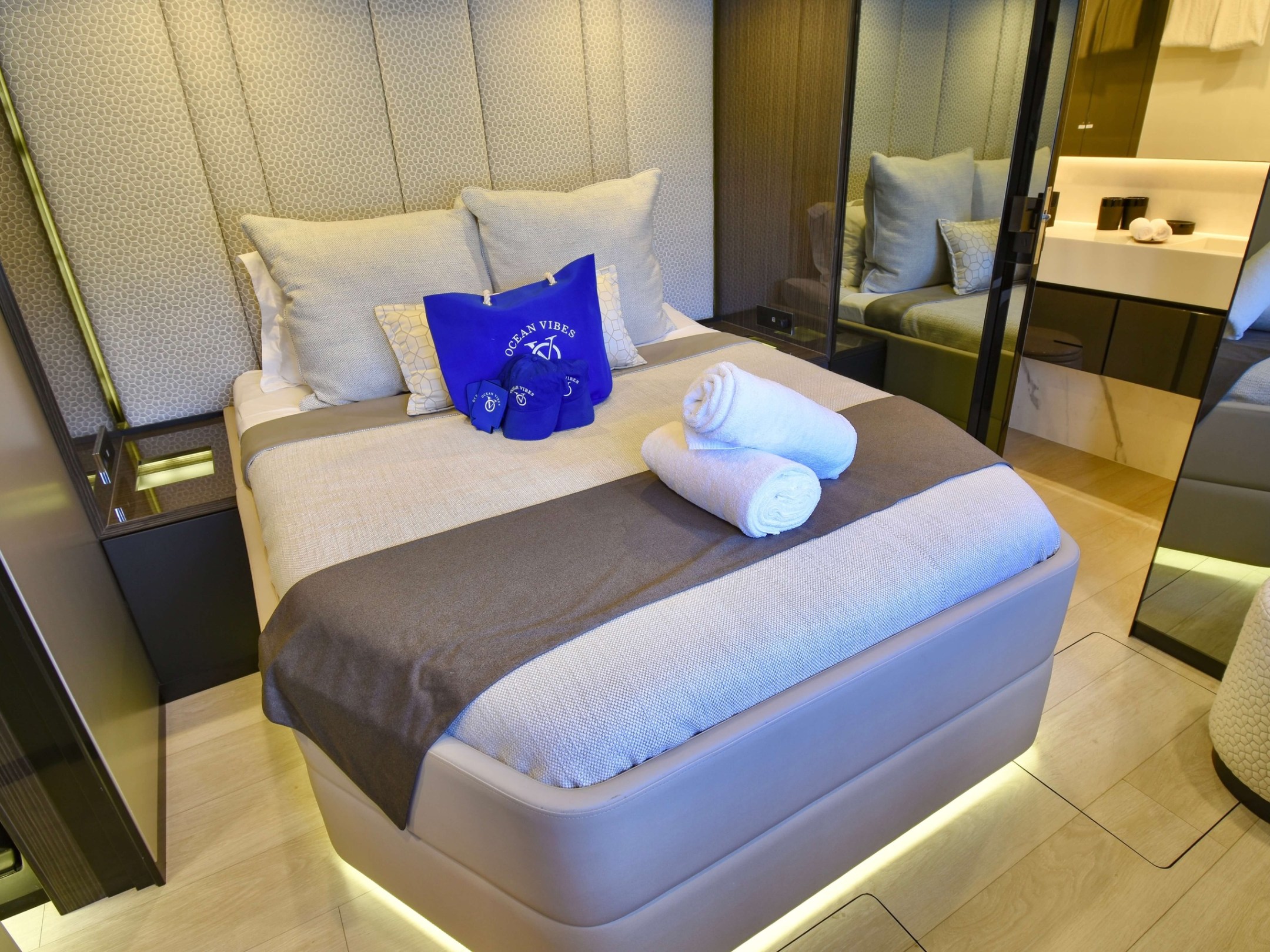 a bedroom with a bed and a chair in a room