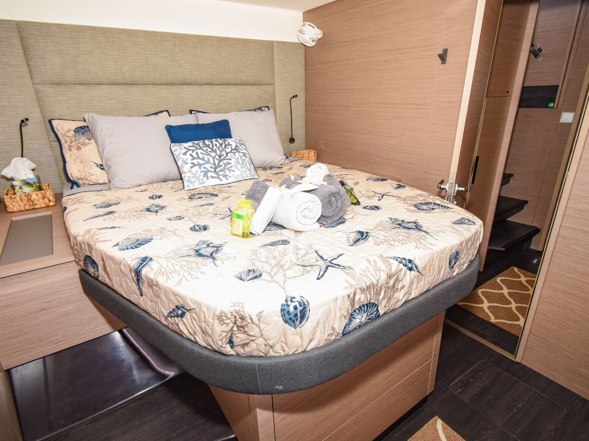 a bedroom with a bed and desk in a room