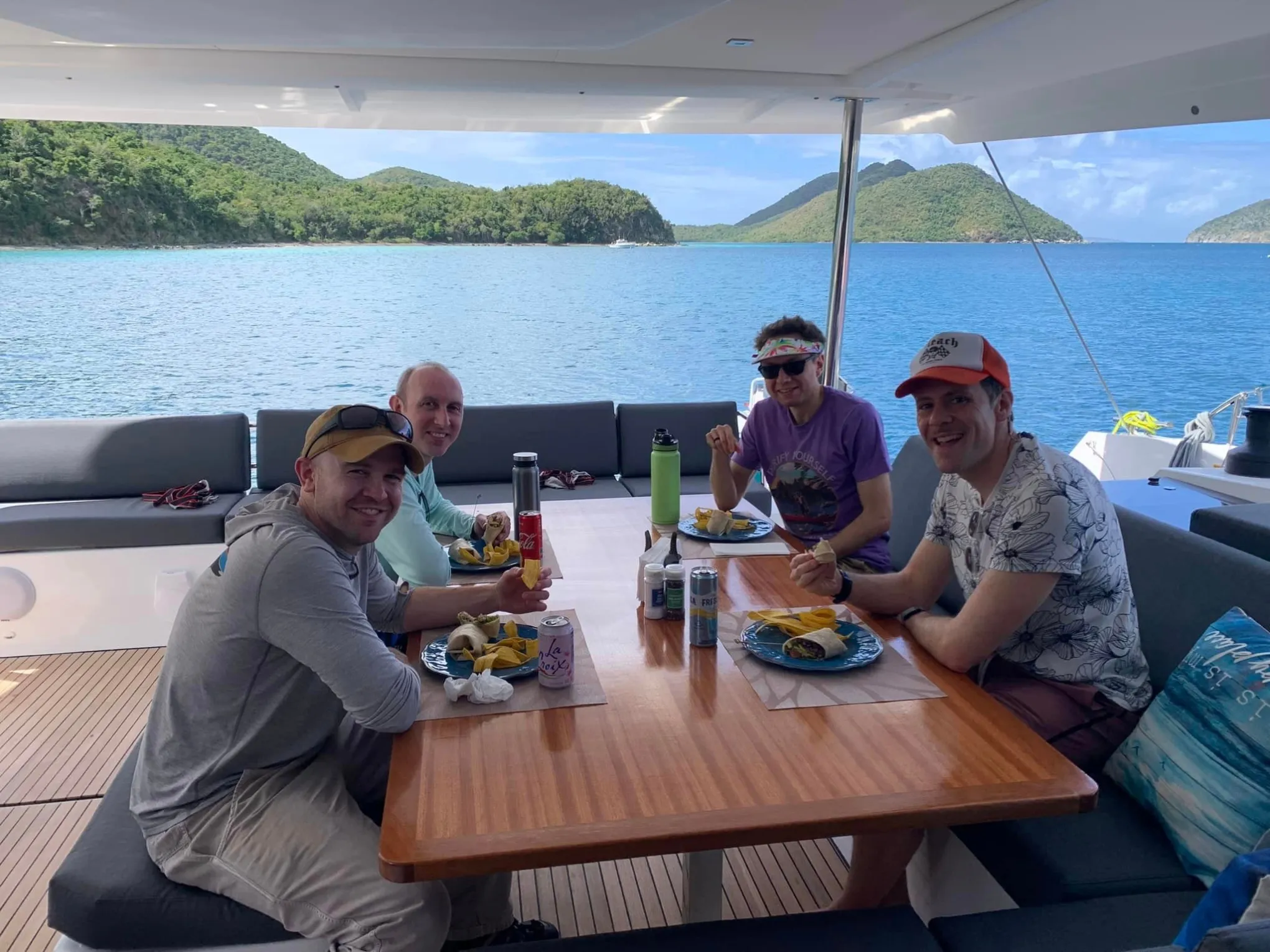 a group of people sitting at a picnic table