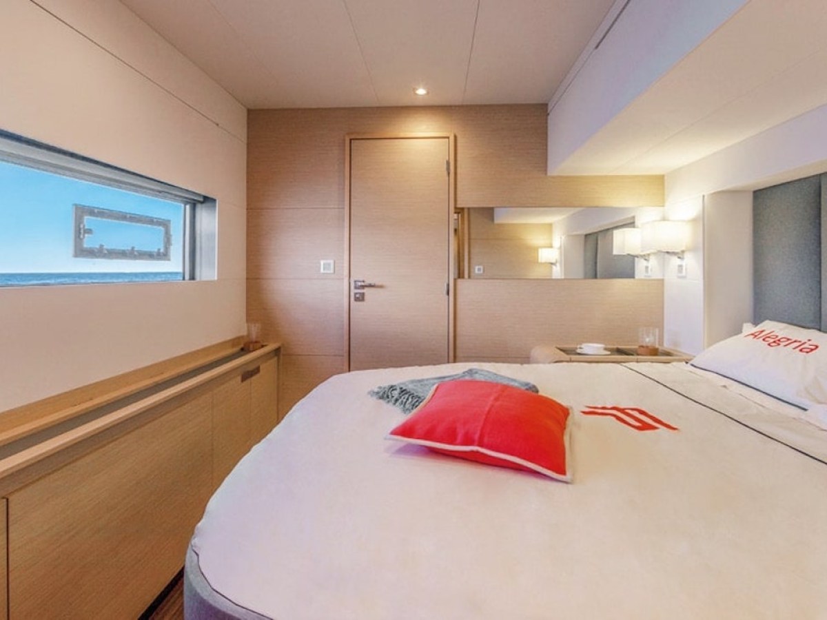 a bedroom with a large bed in a room