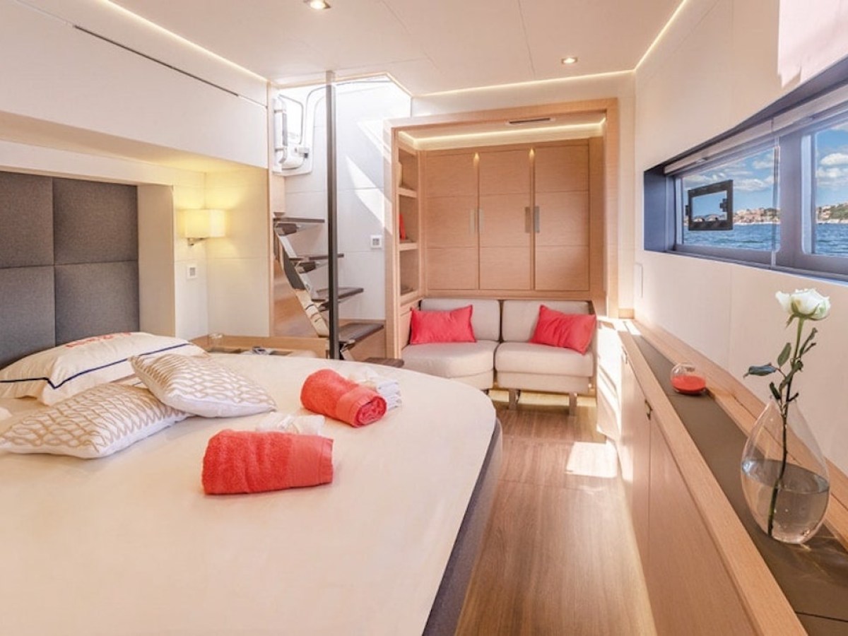 a bedroom with a bed and desk in a room