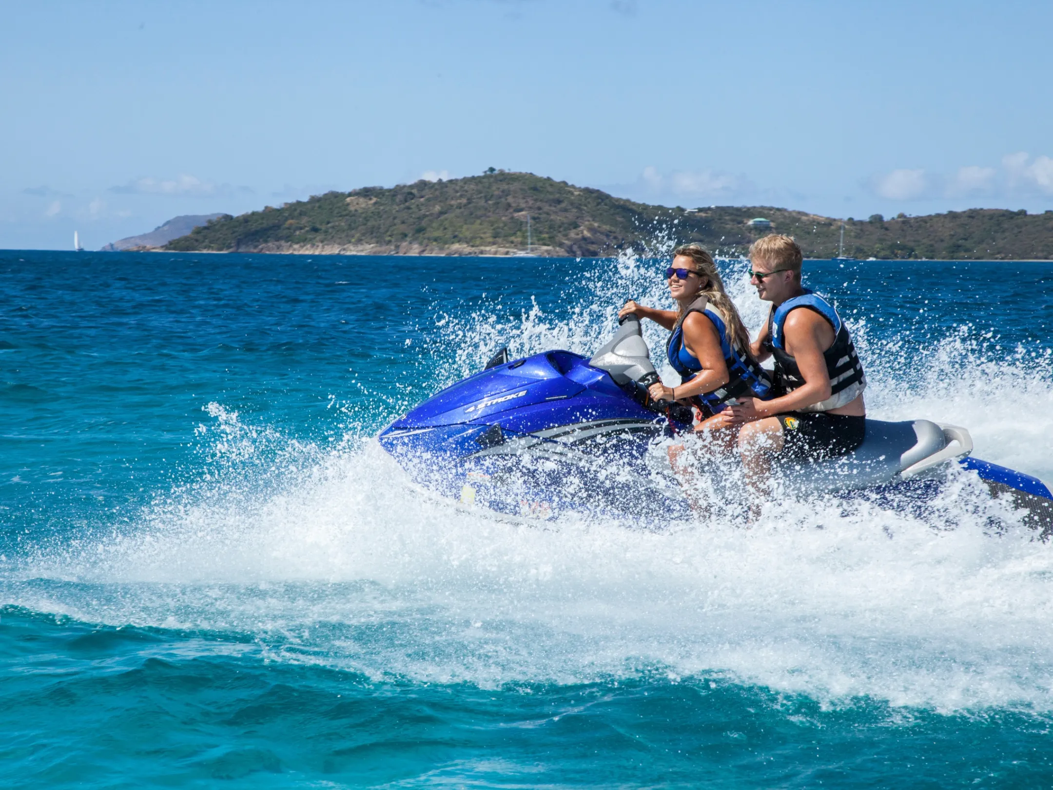 a man riding a wave on a surfboard in the water