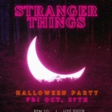 a sign lit up at night