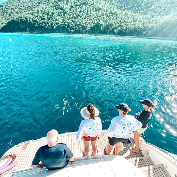 a group of people swimming in a body of water