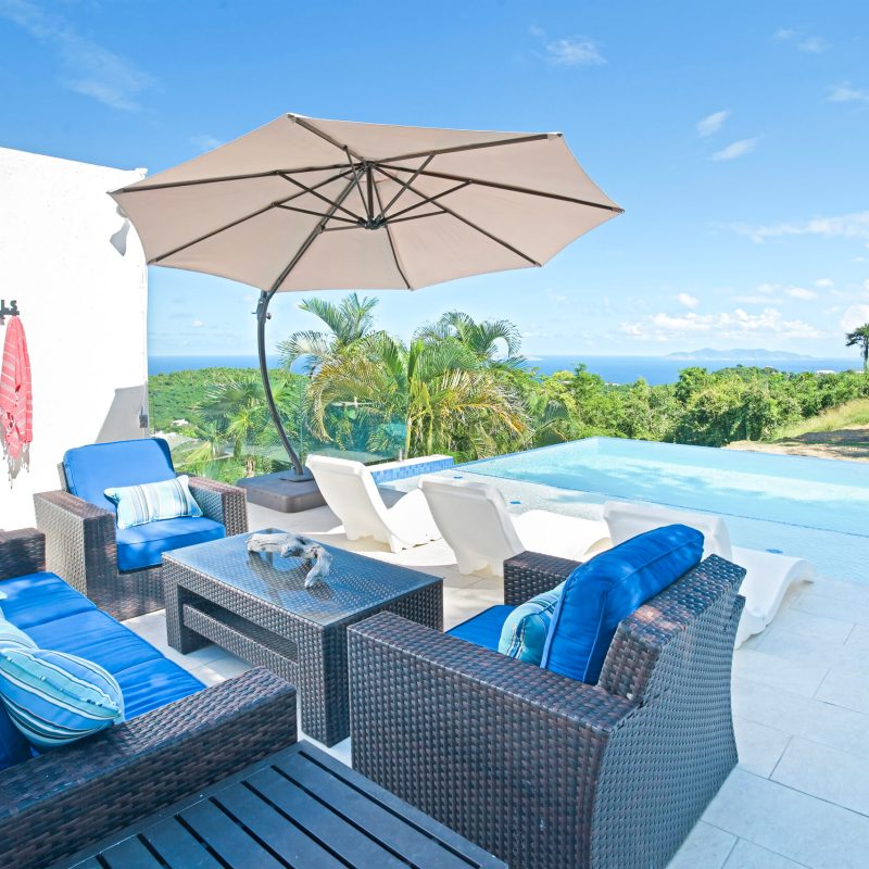 a table topped with a blue umbrella