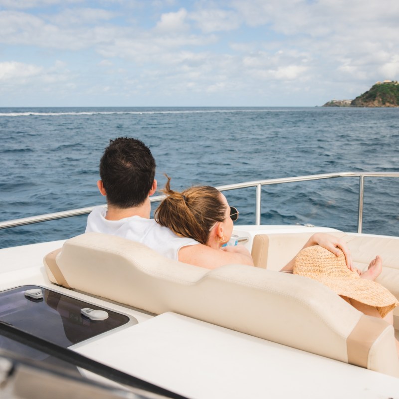 a person sitting on a boat in the water