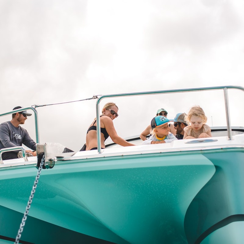a person sitting on a boat in the water