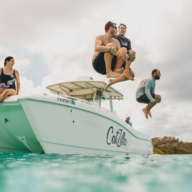 a group of people riding on the back of a boat