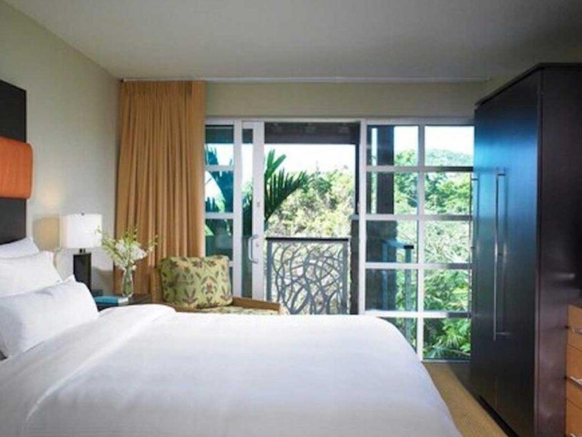 a bedroom with a large bed in a room