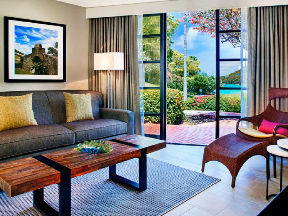 a living room filled with furniture and a large window