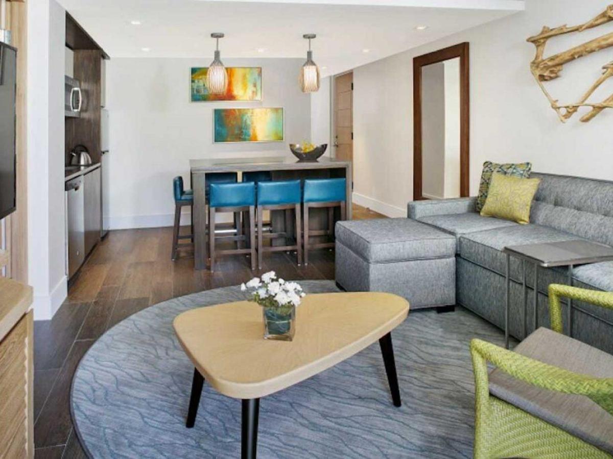 a living room filled with furniture and a table