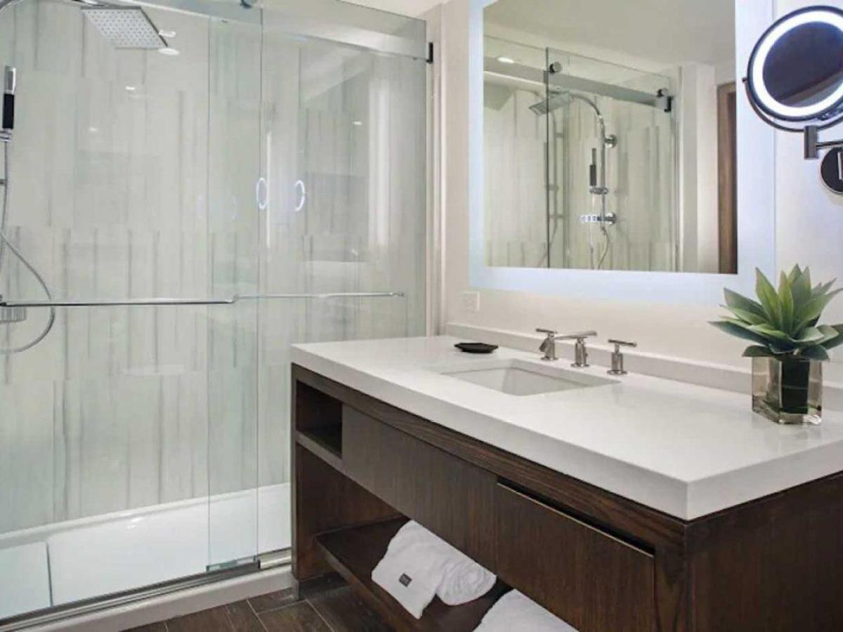 a room with a sink and a mirror