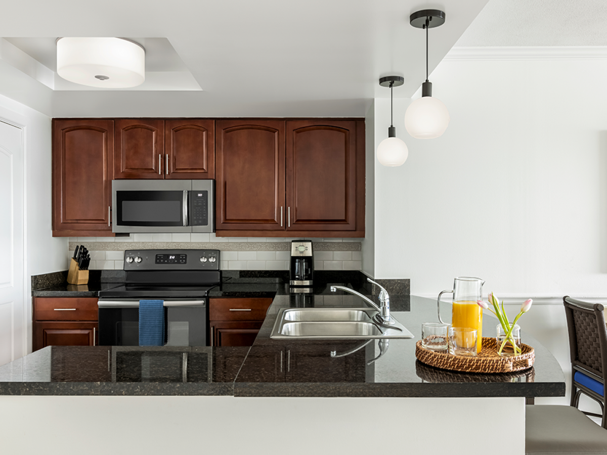 a kitchen with a sink and a microwave