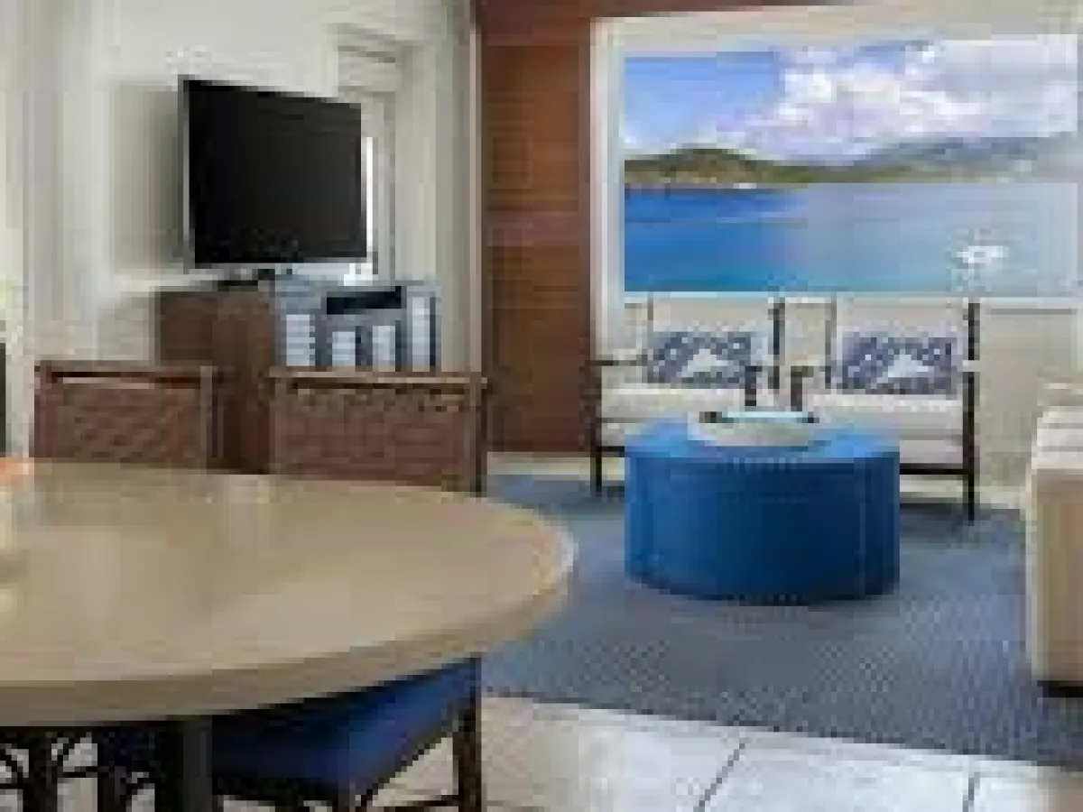 a room filled with furniture and a large window