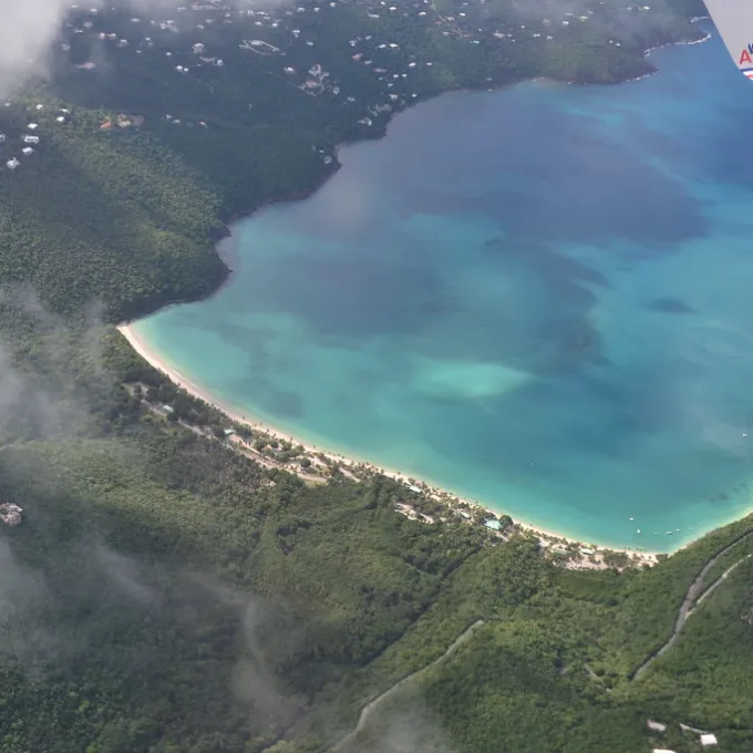 a person flying through the air on top of a mountain