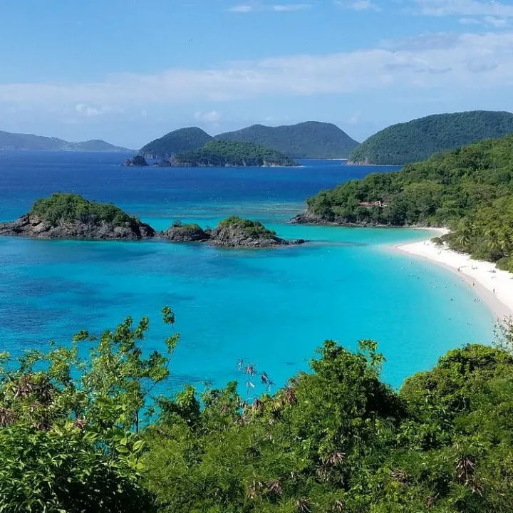 an island in the middle of Virgin Islands National Park surrounded by a body of water