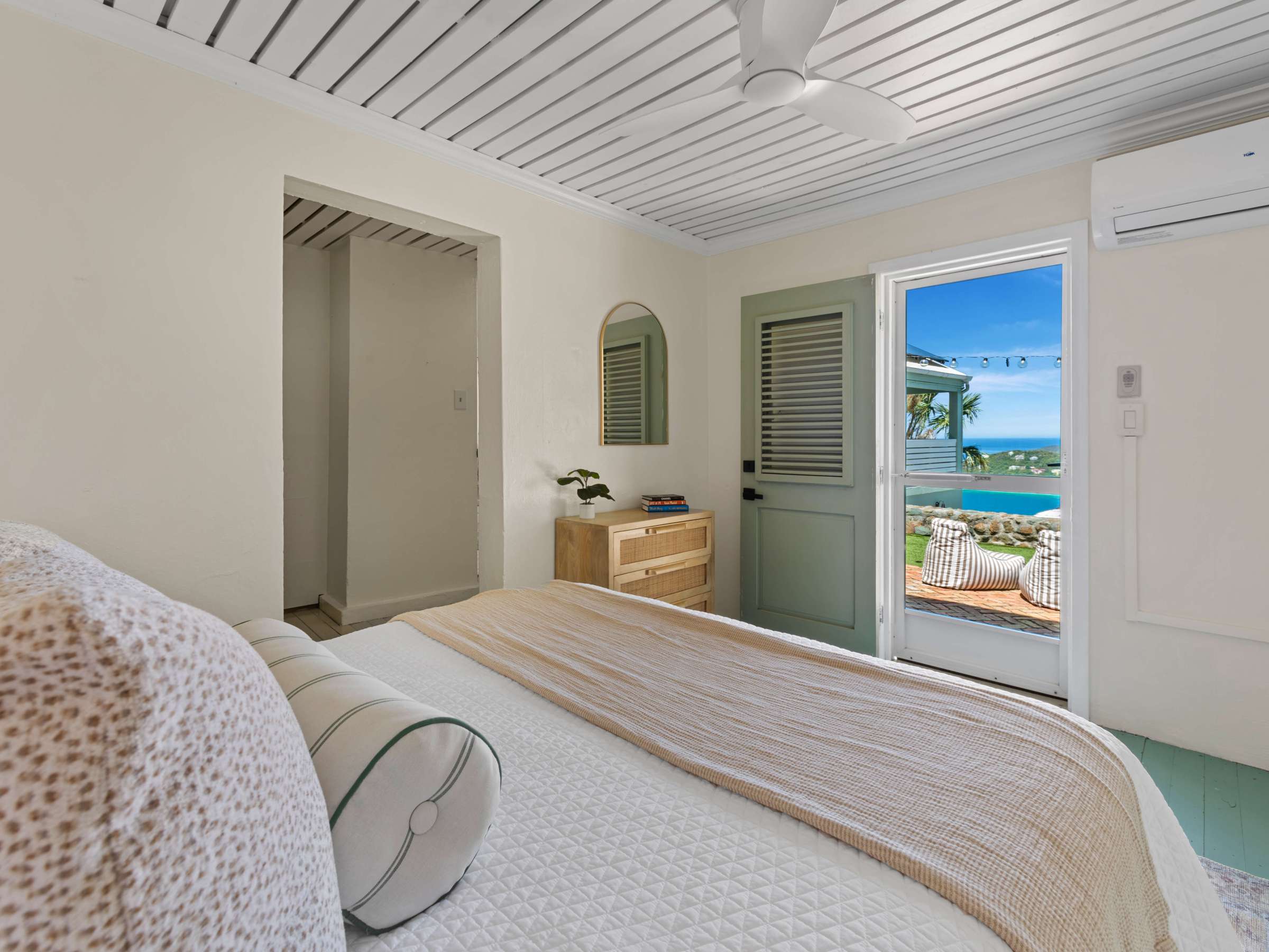 a bedroom with a bed in a room