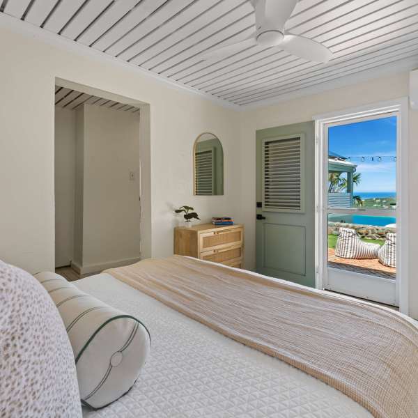 a bedroom with a bed in a room