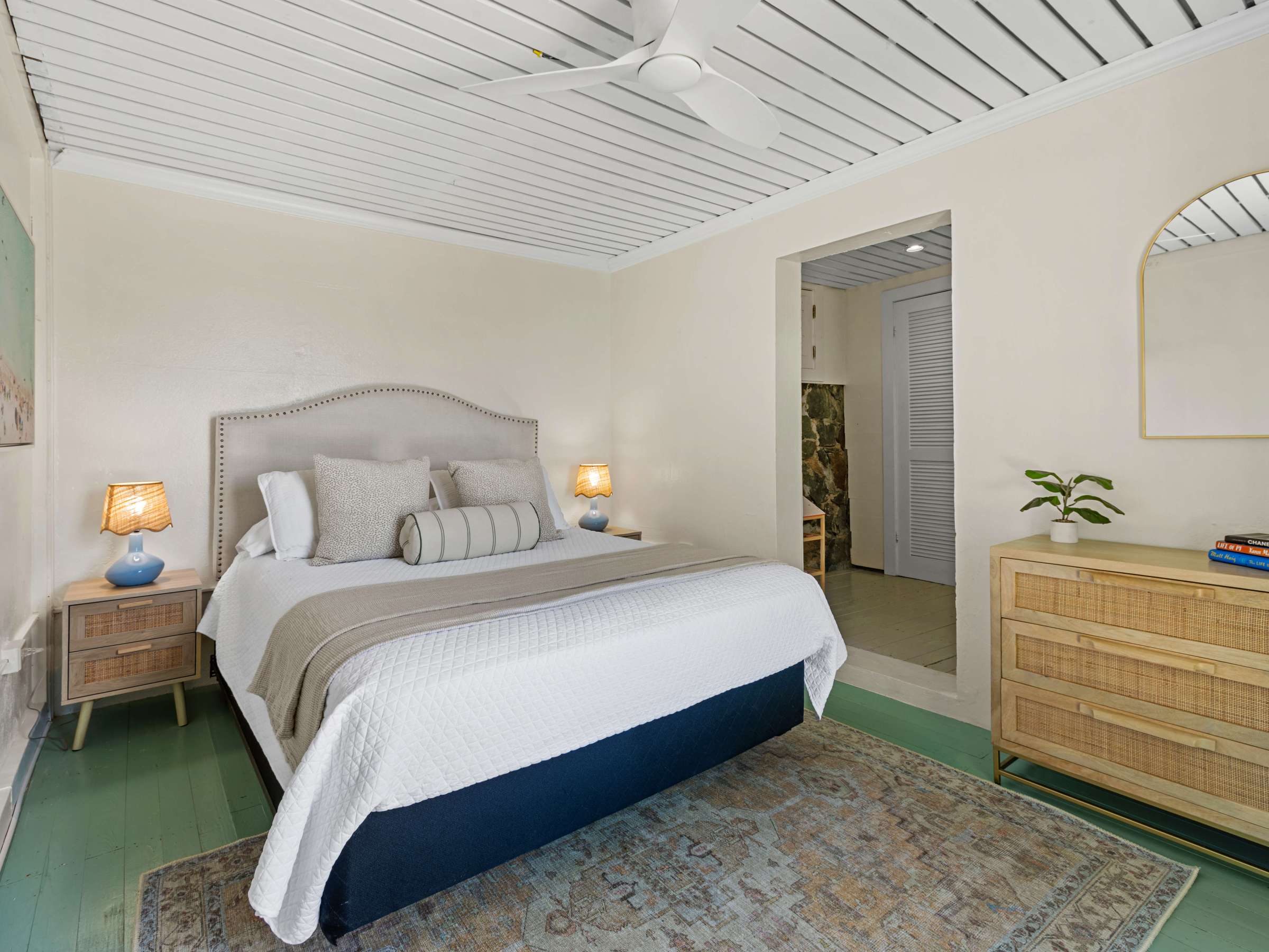 a bedroom with a bed in a room