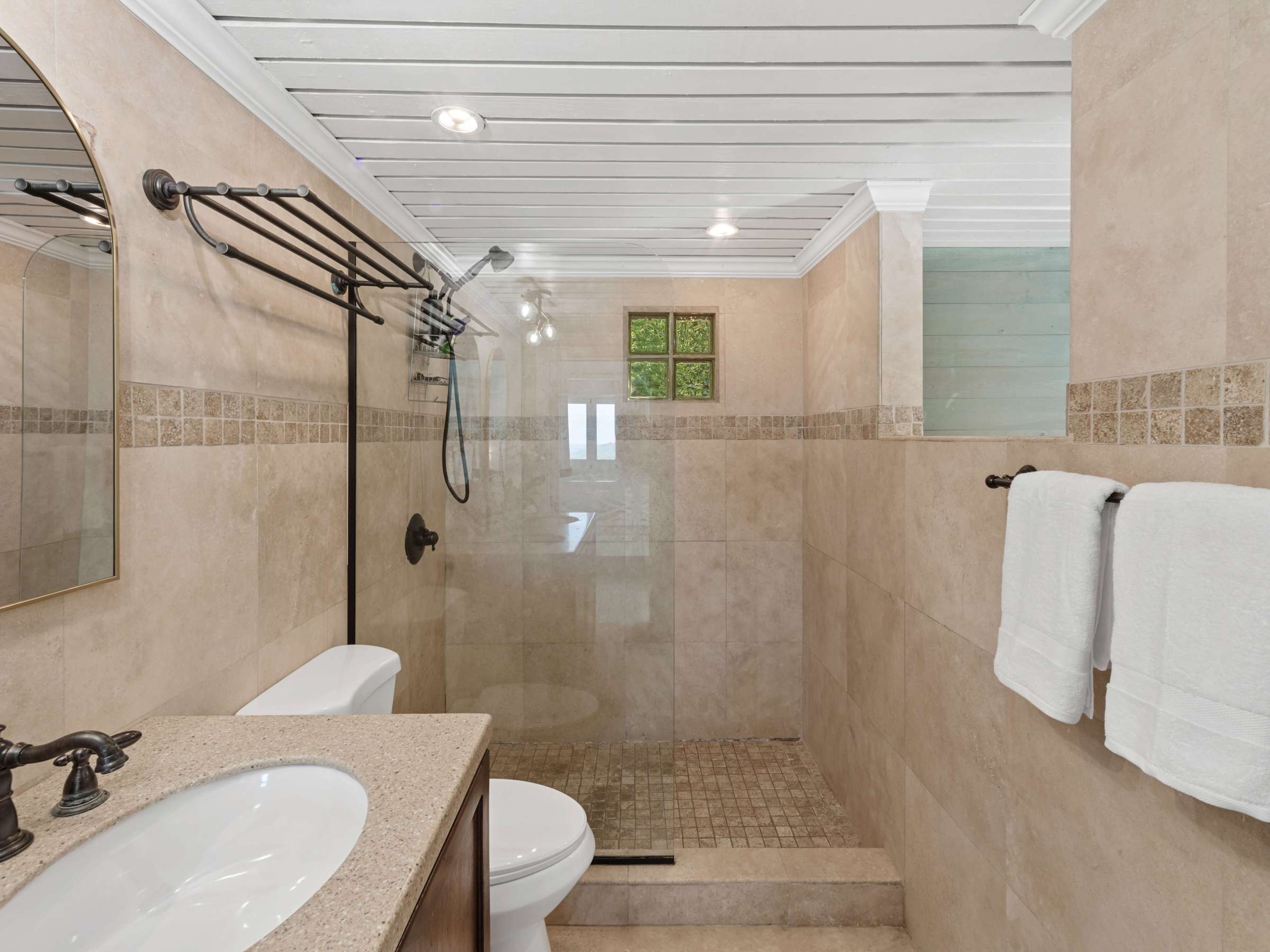 a room with a sink and a mirror