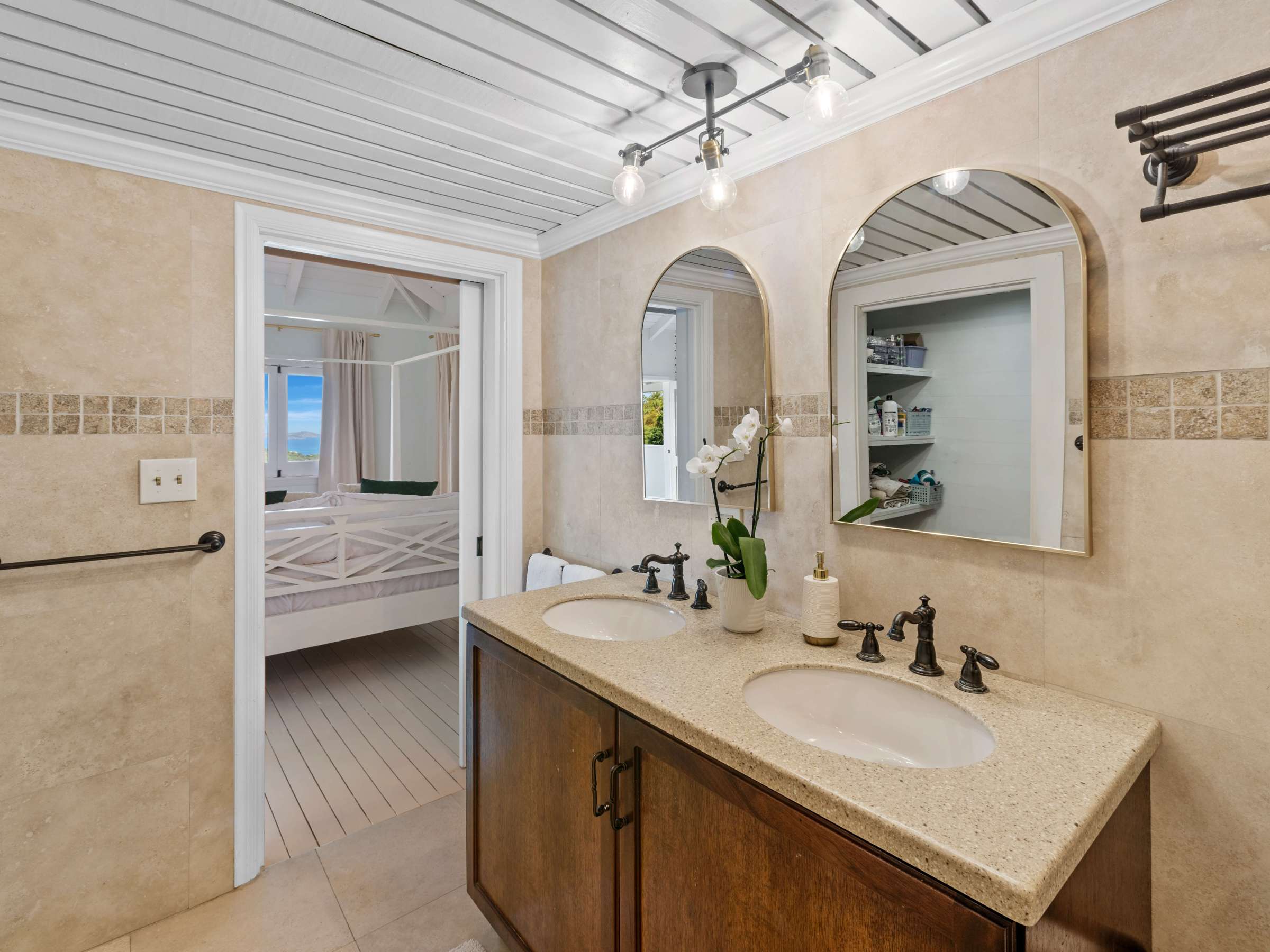 a double sink and large mirror