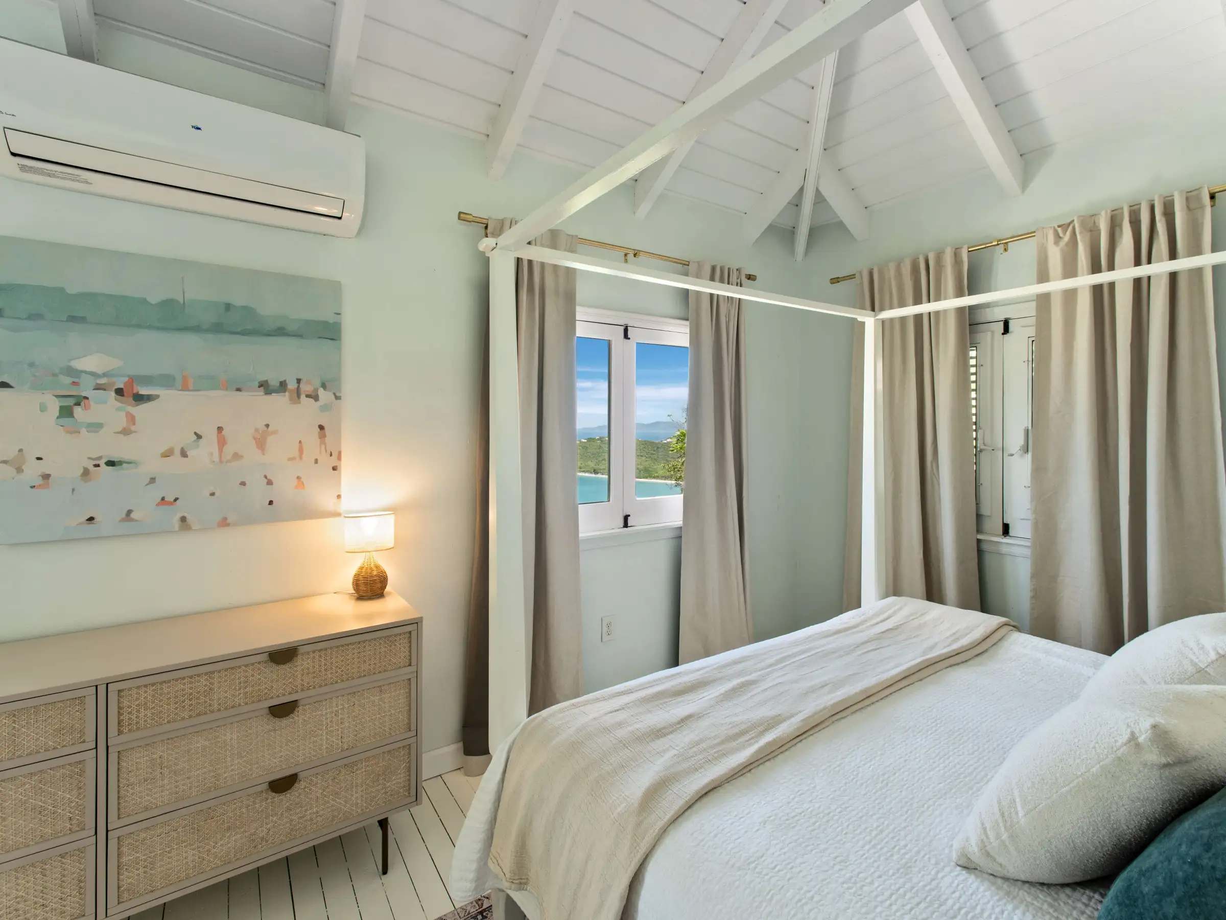 a bedroom with a bed and a mirror