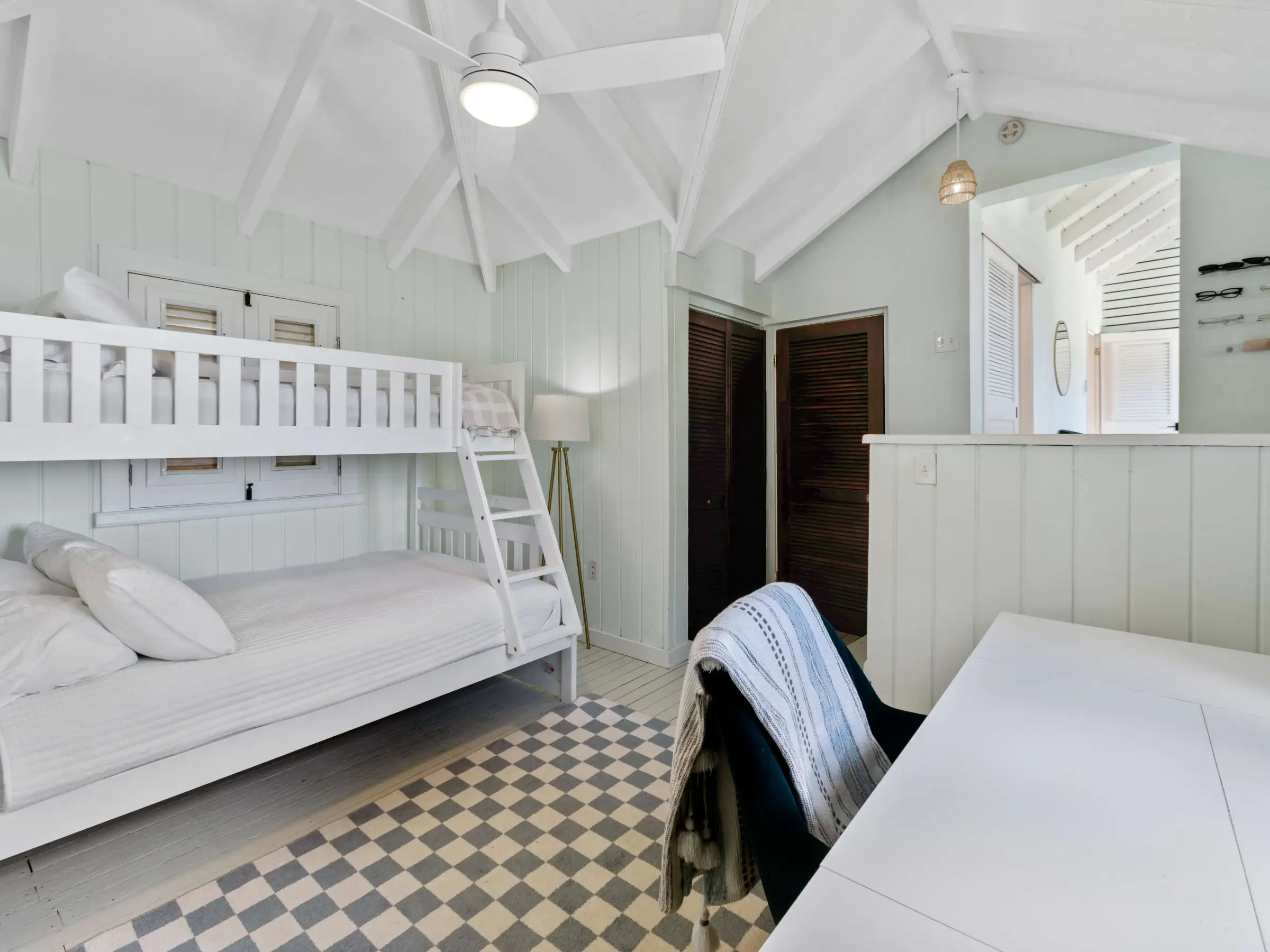 a bedroom with a bed in a room