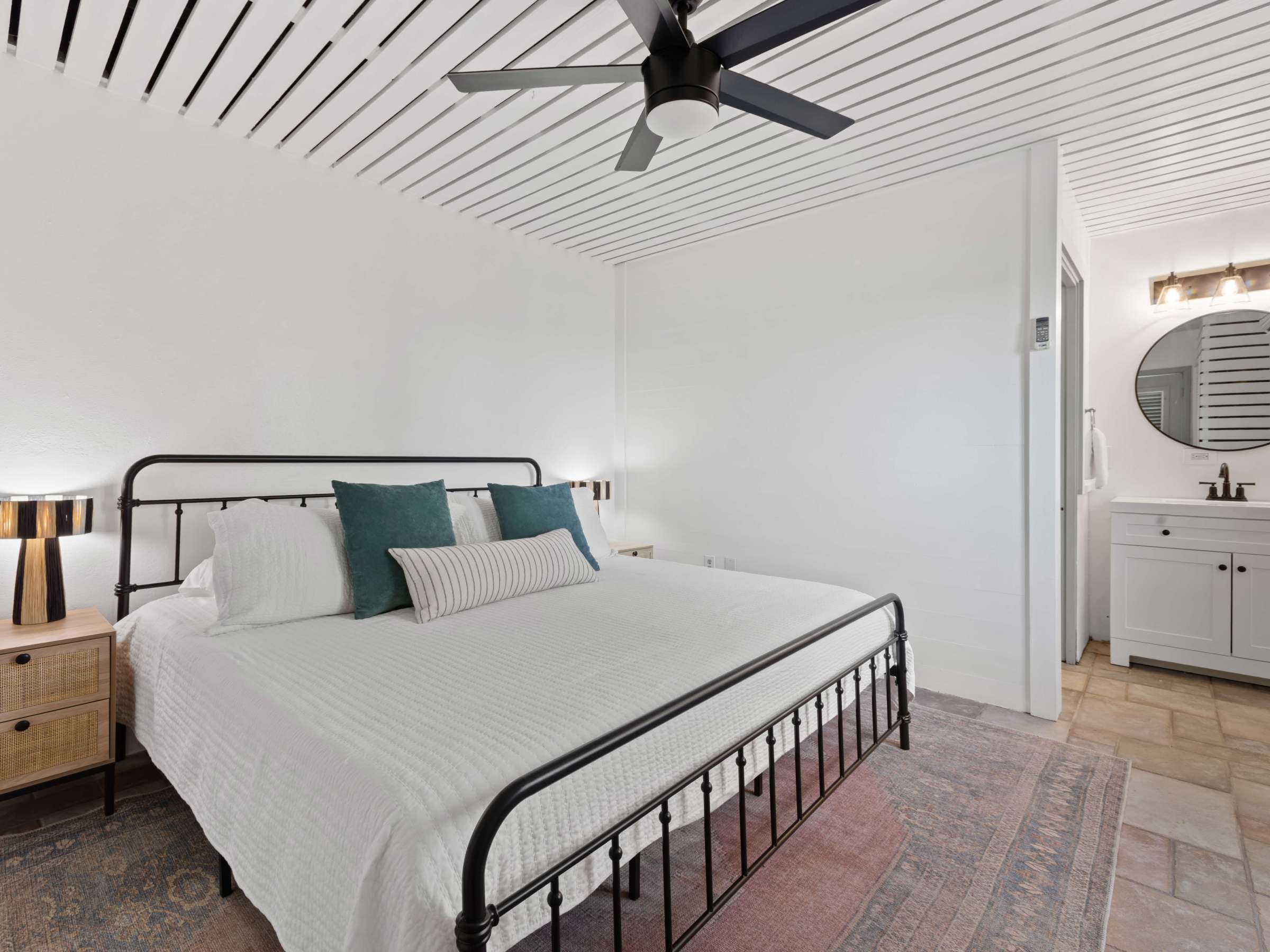 a bedroom with a bed in a room