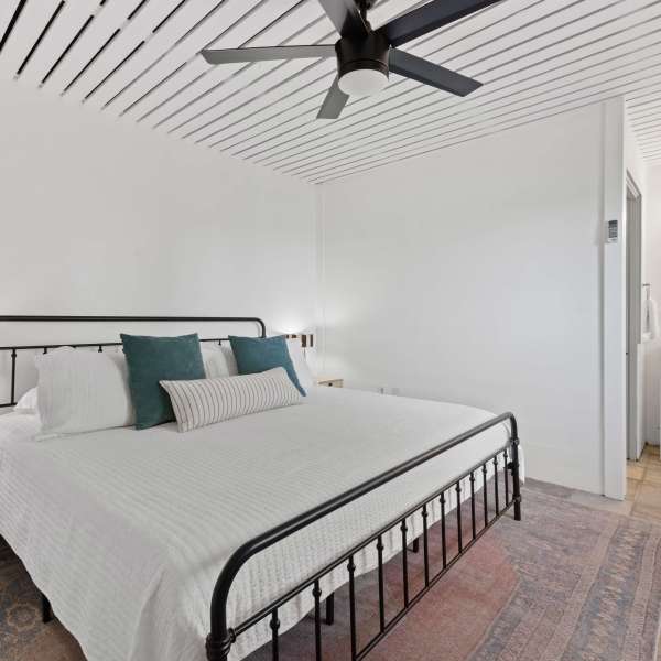 a bedroom with a bed in a room