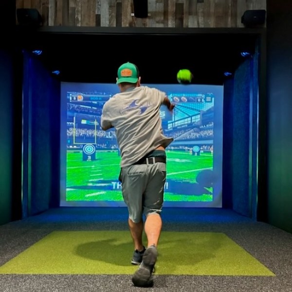 a person standing in front of a television