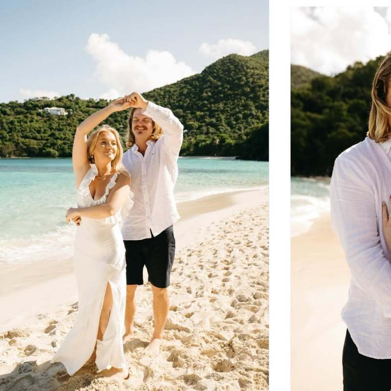 Couple dancing on a beach; woman in white dress, man in white shirt and shorts, green hills in background.
